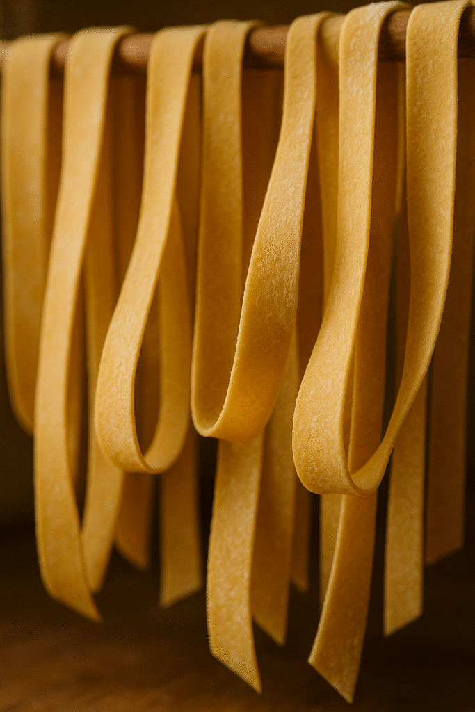 How to Master the Art of Pappardelle Pasta: A Deliciously Complete Guide 10 Pappardelle pasta drying in Tuscan countryside kitchen