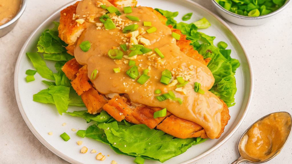 almond chicken recipe plated with toasted almonds